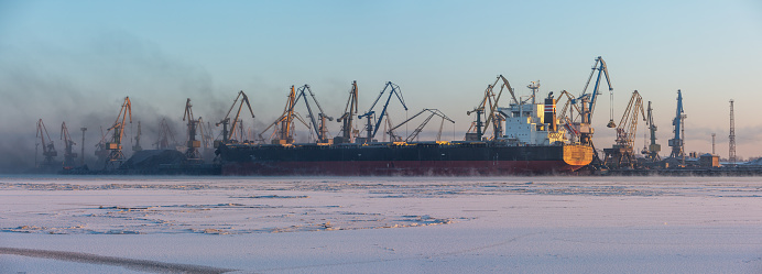 Harbor panorama with ship and coal unloading