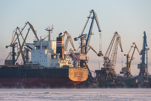 Harbor panorama with ship and coal unloading