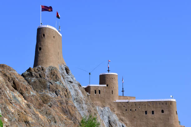 al mirani fort - a 16th century portuguese bastion - crenellated towers and ramparts, muscat, oman - al mirani imagens e fotografias de stock