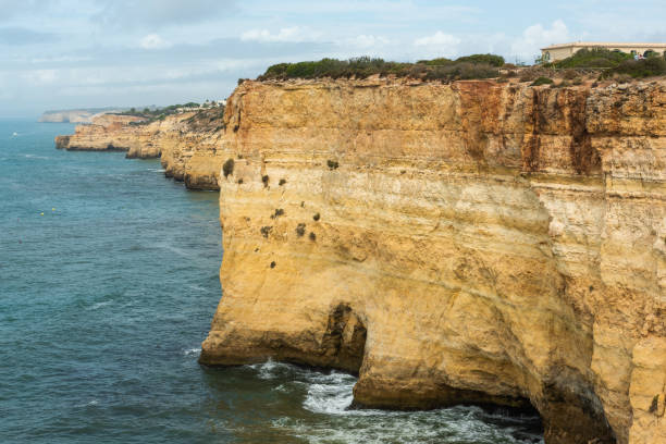Cliffs and beach at Algarve coast in Portugal.
