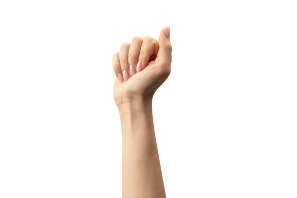 istock Hand of a woman holds some tiny or thin object. 1715369364