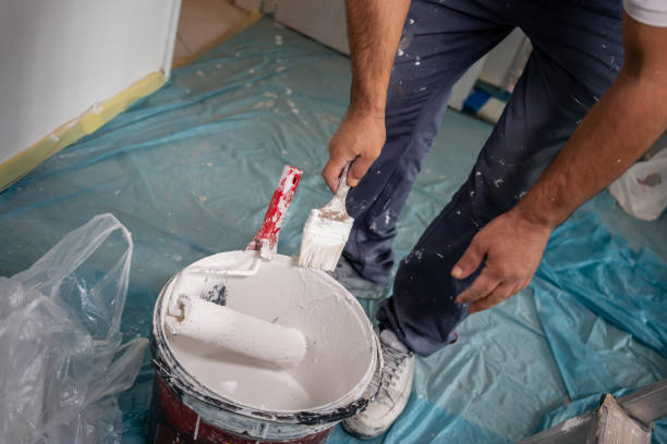 istock painting brush is in blue collar worker for painting wall horizontal construction still 1715382016
