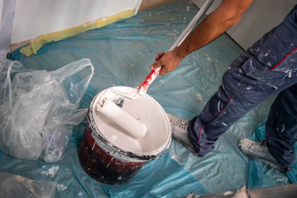 istock blue collar worker is painting cropped horizontal construction still 1715408841