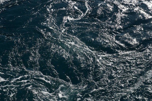 istock Rippled sea water with white foam, bubbles and sea vortexes 1715409934