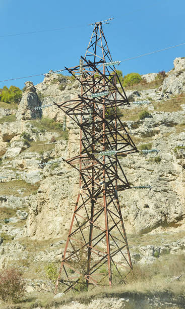 istock A high-voltage tower for transmitting electricity through wires standing in a mountainous area. Energy industry. 1715413357