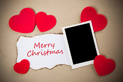 Paper with ,, Merry Christmas'' and hearts