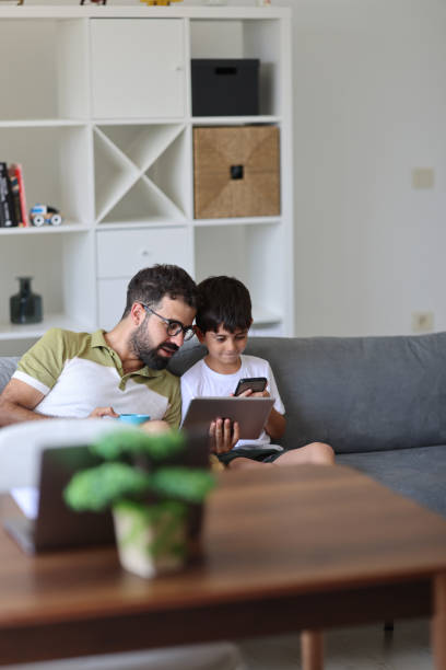 istock Father trying to work from home 1715418304