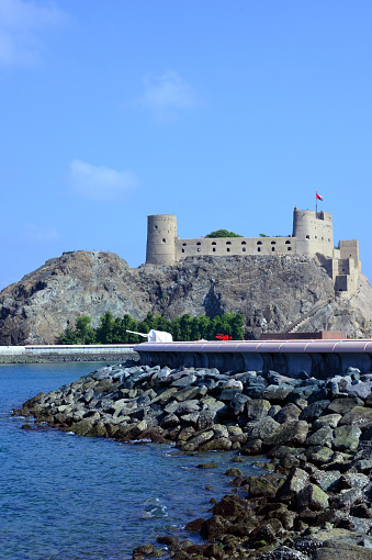 Old Muscat, Oman: Aljalali Fort or Eastern Fort, originally 'Forte de São João' (Fort St. John) is a harbor fort in Old Muscat , erected by the Portuguese Empire by order of King Philip I, between 1586 and 1588, to protect the port after Muscat had been raided twice by Ottoman forces. In 1650, it fell to Omani forces. In the Omani civil wars between 1718 and 1747, it was captured twice by the Persians invited to support one of the rival imams. It then underwent extensive reconstruction. On several occasions, it served as a refuge or prison for members of the royal family. For much of the 20th century it was used as Oman's main prison.