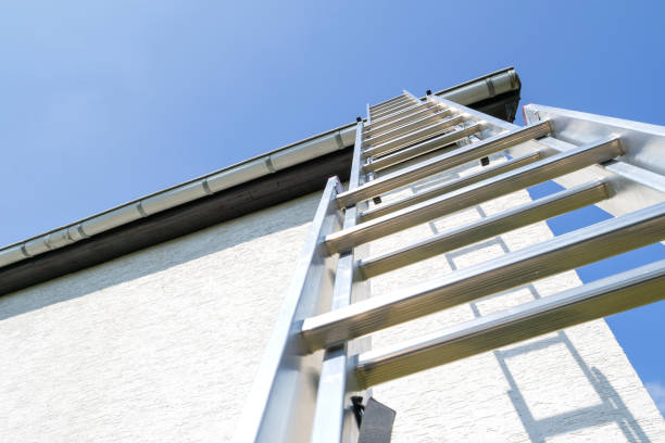 three section aluminum ladder leaning against house