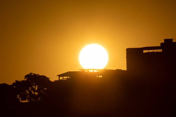 sunset under city silhouette