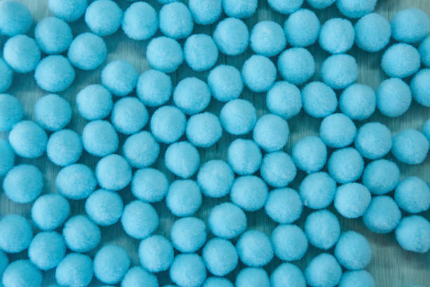 istock Soft fluffy ball as accessories for sewing production. Lots of blue objects. 1715443813