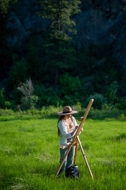 istock Artist painting outdoors in nature 1715445536