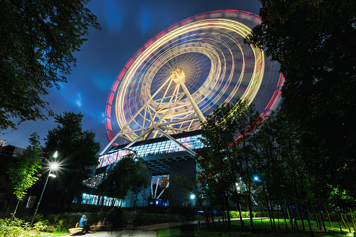 Ferris wheel at night in the park, Moscow, Russia.