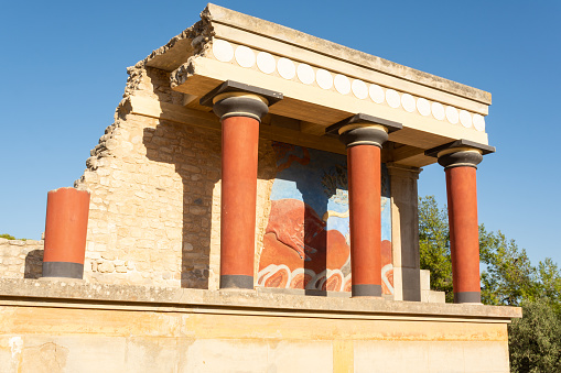 Knossos, Heraklion, Crete, Greece - September 21st 2023 - The reconstructed ruins of the west bastion of Knossos Palace in the morning sunlight.