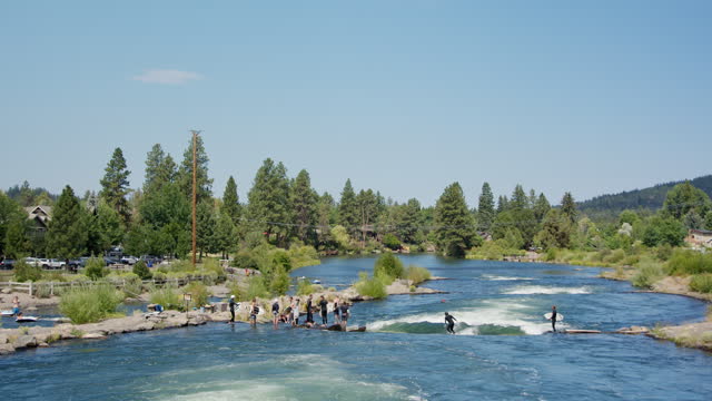 People Tubing and Surfing in Bend, Oregon
