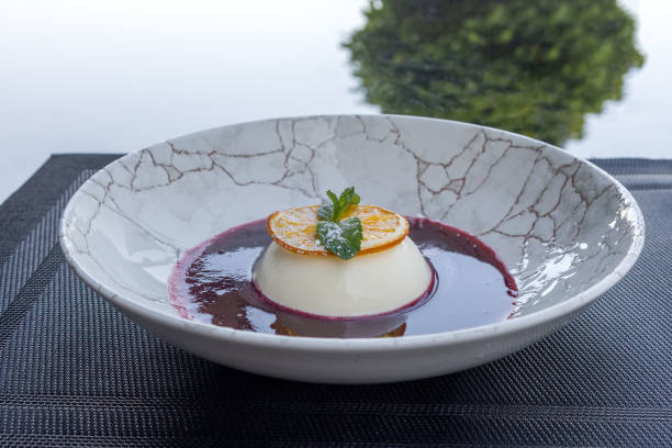 istock Panna cotta with raspberry sauce. Delicious light dessert. 1715459976