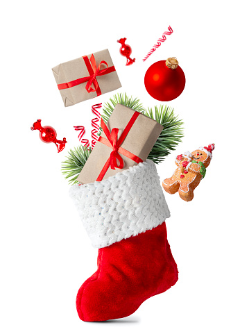 Christmas stocking red with gifts, lollipop, gift boxes, candy, cookies man isolated on white background