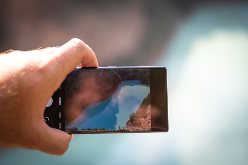 View of a beautiful lake through phone camera