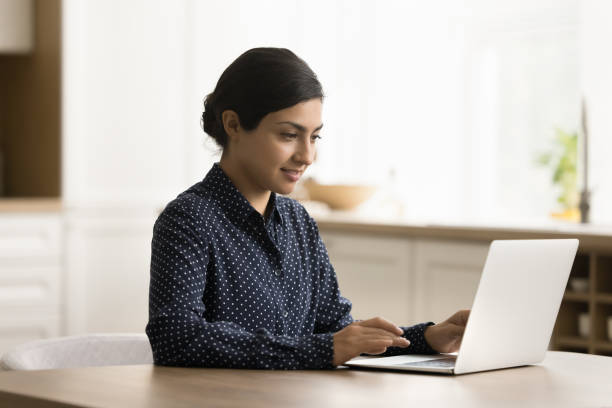 istock Successful focused Indian freelancer woman working from home 1715485868