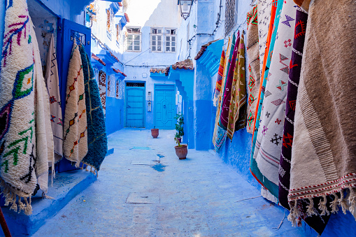 Chefchaouen, or Chaouen, is a city in the Rif Mountains of northwest Morocco.  It’s known for the striking, blue-washed buildings of its old town. Rugs for sale hanging along the street.
