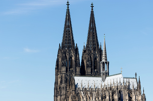 Cologne Cathedral. It is Germany's most visited landmark, attracting an average of 20,000 people a day and currently the tallest twin-spired church at 157 m (515 ft) tall.