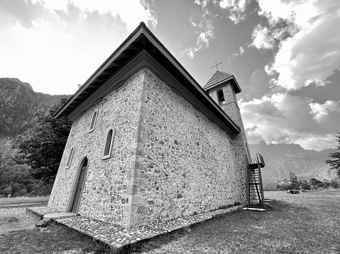 Christian Church in the village of Theth National Park , Shkoder Albania.  Horizontal black and white photo.