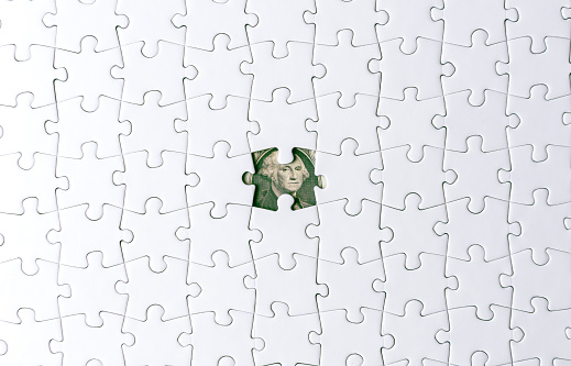 space a piece of jigsaw to connect success on wooden table top selected focus