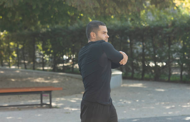 istock Male jogger athlete training and doing workout outdoors in city. 1715500652