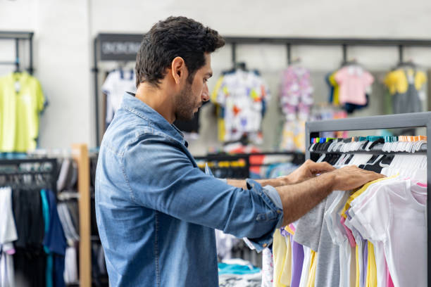 istock Man shopping at a clothing store 1715504007