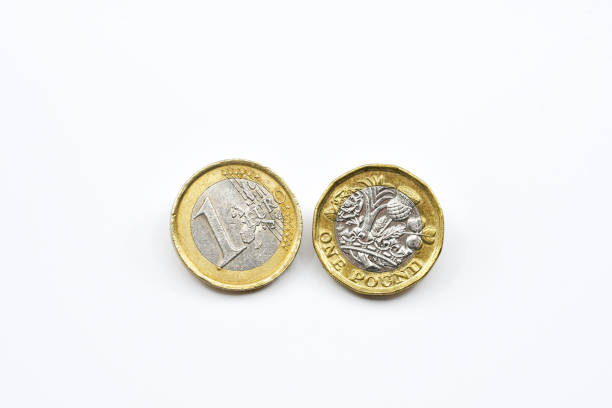 istock One Euro coin and one British Pound coin side by side on a plain white background 1715505700