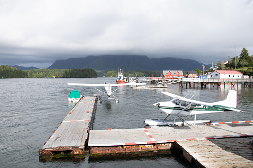 Harbour in the sea  with planes and view of the mountains