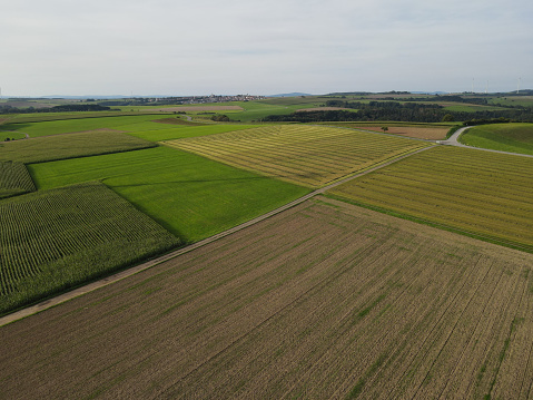 Aerial view of a countryside with many agriculture fields in summer