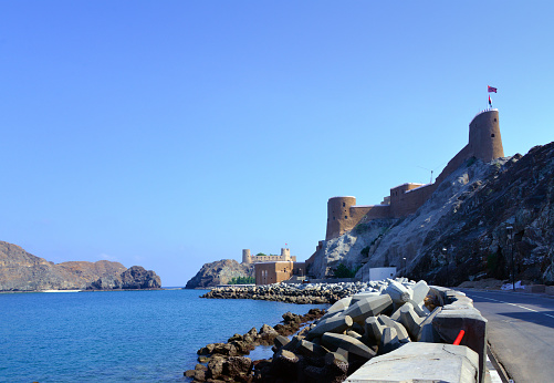 Old Muscat, Oman: Al-Mirani Fort and Al Jalali Fort and the corniche road - these fortresses, as many other in the Middle-East were built by the Portuguese in the 16th century as part of their efforts to control the Indian Ocean.