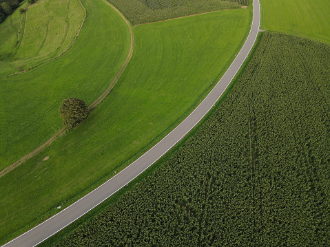 View from above of a rural asphalt road in the landscape in summer