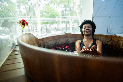 Senior woman in a bathtub at a spa