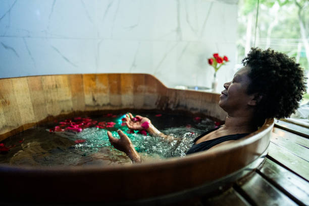 istock Senior woman in a bathtub at a spa 1715527890
