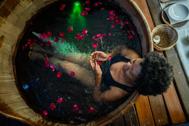 istock Senior woman in a bathtub at a spa 1715527891