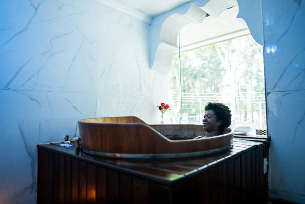Senior woman in a bathtub at a spa