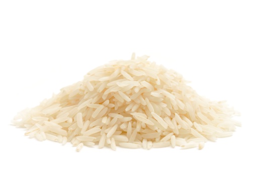 Basmati rice in a heap isolated on a white background.