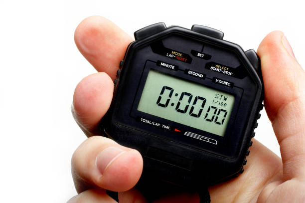 Man holding a black digital stopwatch set to zero Hand holding a digital stopwatch. Ready to start timing. stopwatch photos stock pictures, royalty-free photos & images