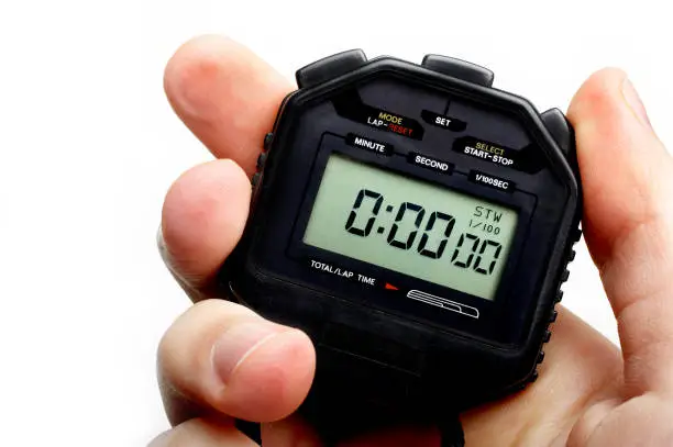 Hand holding a digital stopwatch. Ready to start timing.