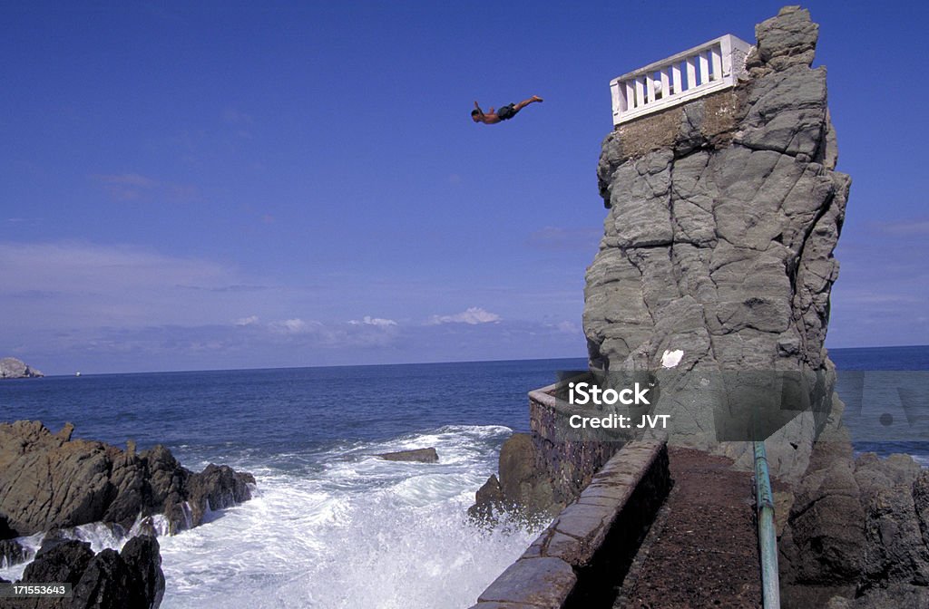 Mazatlan, Mexico cliff diver. "Mazatlan, Mexico cliff diver gives a performance." Cliff Diving Stock Photo