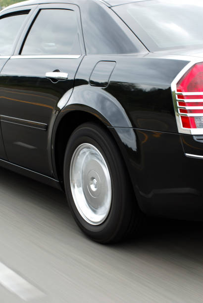 istock car driving down the road high speed 171554269
