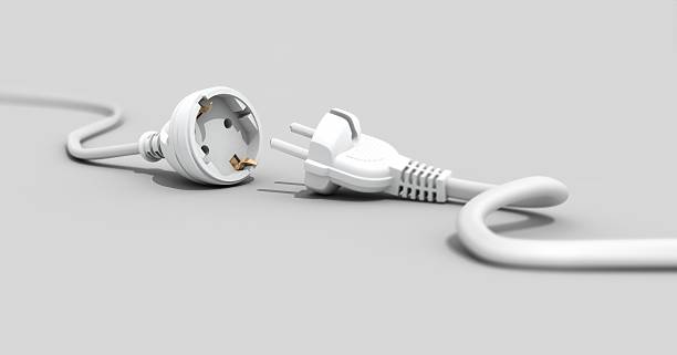 One white plug unplugged from another white plug stock photo