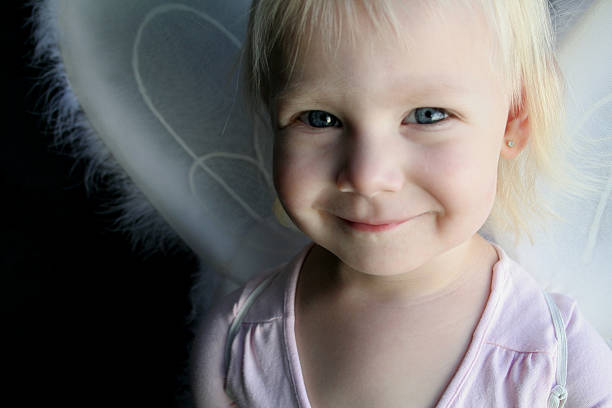 smiling angel stock photo