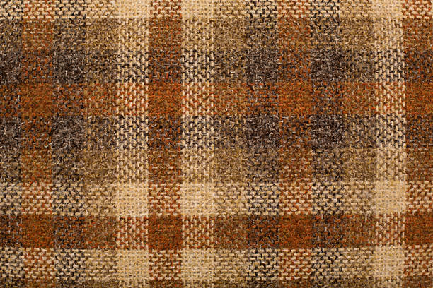 Close Up, Color Image of Retro Plaid Textile "Color image of an old, retro rust, brown, and beige swatch of cloth." tweed stock pictures, royalty-free photos & images