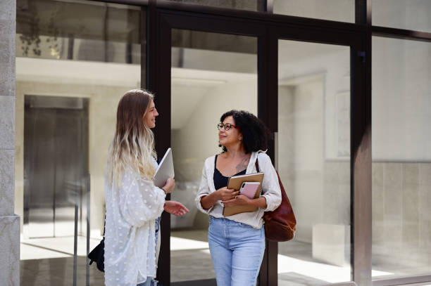 istock University teacher talking with a female student at university campus. 1715552932