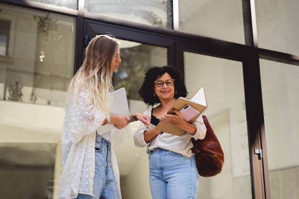 istock Multiracial adults students discussing the lessons at a university campus. 1715552950