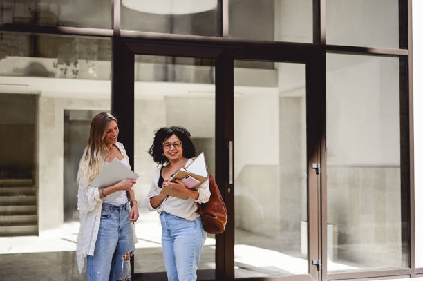 istock Students standing at the campus and discussing lessons. 1715553498