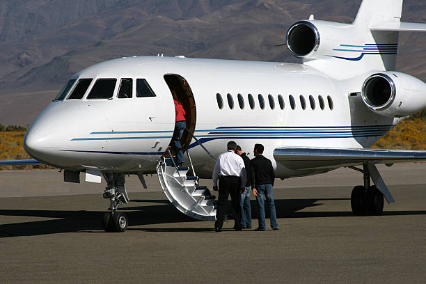 Falcon 900 Charter Jet loading passengers.   